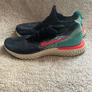 Nike blue and Teal Running Shoes with Neon Swoosh Size 12.
